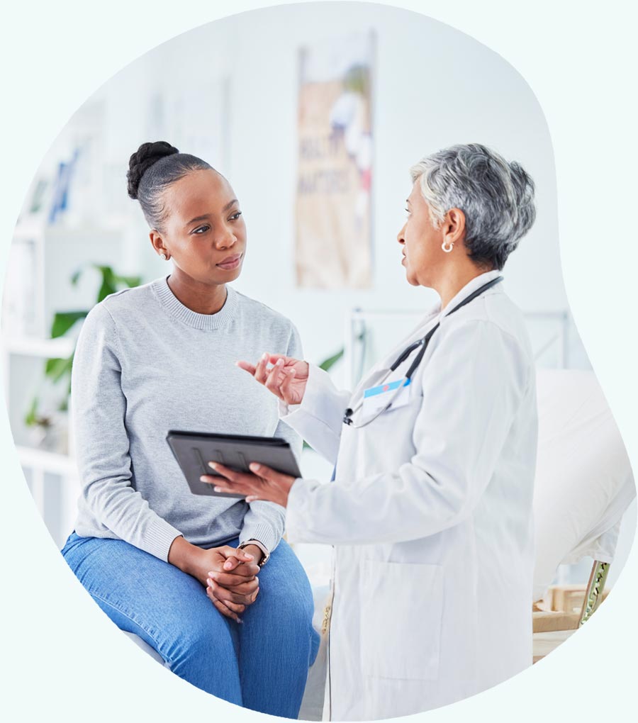 Female doctor consulting with female patient - Brenzavvy