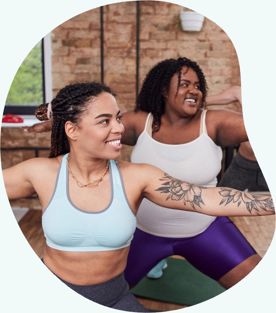 Two women doing yoga - Brenzavvy