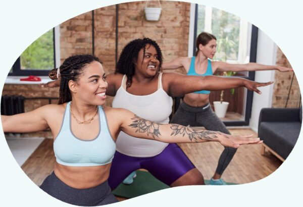 Three women doing yoga - Brenzavvy